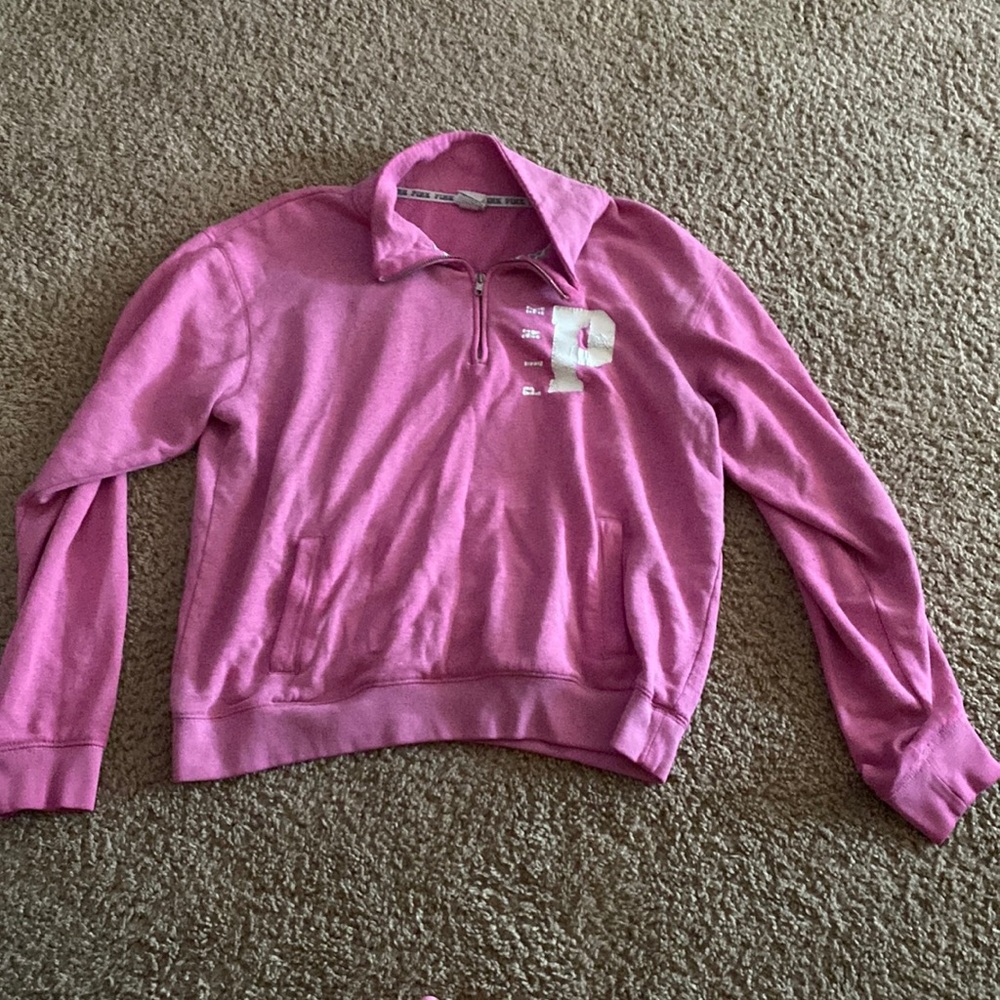 Pink sweatshirt.